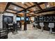 Basement game room with bar, game table, and stone feature wall at 4317 Oglethorpe Nw Loop, Acworth, GA 30101