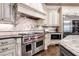 Gourmet kitchen with high-end appliances and custom cabinetry at 4317 Oglethorpe Nw Loop, Acworth, GA 30101