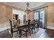 Formal dining room with a large table, chandelier, and hardwood floors at 4317 Oglethorpe Nw Loop, Acworth, GA 30101