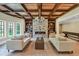 Spacious basement recreation room with stone fireplace and coffered ceiling at 4317 Oglethorpe Nw Loop, Acworth, GA 30101