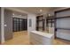 Spacious walk-in closet with custom built-ins and glass doors at 3206 Arden Rd, Atlanta, GA 30305