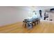 Elegant dining room with large table, statement wall, and hardwood floors at 3206 Arden Rd, Atlanta, GA 30305