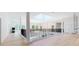 Bright hallway with hardwood floors, skylight, and elegant columns at 3206 Arden Rd, Atlanta, GA 30305