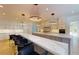 Modern kitchen with marble countertops, breakfast bar, and stainless steel appliances at 3206 Arden Rd, Atlanta, GA 30305