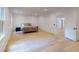 Spacious bedroom with hardwood floors and an open door to the hallway at 3206 Arden Rd, Atlanta, GA 30305
