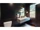 Elegant bathroom with dark walls, marble floating vanity, and gold accents at 3206 Arden Rd, Atlanta, GA 30305