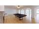 Game room featuring a pool table, hardwood floors, and access to other rooms at 3206 Arden Rd, Atlanta, GA 30305