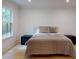 Light-filled bedroom with hardwood floors and a large window at 3206 Arden Rd, Atlanta, GA 30305