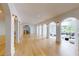 Open floor plan basement with hardwood floors, arched doorways and access to outdoor patio at 3206 Arden Rd, Atlanta, GA 30305