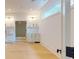 Finished basement with wet bar, light hardwood floors, and plenty of space for entertaining at 3206 Arden Rd, Atlanta, GA 30305