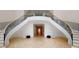 Elegant double staircase with black railings and hardwood floors at 3206 Arden Rd, Atlanta, GA 30305