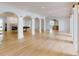 Expansive basement recreation area with hardwood floors and arched details at 3206 Arden Rd, Atlanta, GA 30305