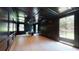 Spacious home office with dark wood paneling, hardwood floors, and natural light at 3206 Arden Rd, Atlanta, GA 30305