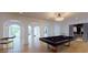 Bright game room with pool table, hardwood floors, and arched hallways at 3206 Arden Rd, Atlanta, GA 30305