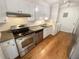 Galley kitchen with stainless steel appliances and wood floors at 3266 Henderson Mill Rd # C, Atlanta, GA 30341