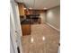 Basement kitchen with tile floor and wood cabinets at 1311 N Brandy Se Shls, Conyers, GA 30013