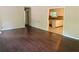 Open living room with hardwood floors and kitchen view at 7508 Asbury Manor Dr, Lithonia, GA 30058