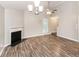 Living room with hardwood floors, fireplace and ceiling fan at 1054 Plantation Nw Way, Kennesaw, GA 30144