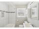 Clean bathroom with shower/tub, vanity, and window at 107 Gladstone Sw Dr, Marietta, GA 30060