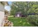 Backyard with grass, trees, and storage shed at 107 Gladstone Sw Dr, Marietta, GA 30060