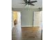 Large bedroom with ceiling fan and wood-look floors at 603 Brighton Ct, Norcross, GA 30071