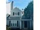 Gray siding, black shutters, and a charming front entrance at 603 Brighton Ct, Norcross, GA 30071