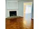 Living room featuring a fireplace and hardwood floors at 603 Brighton Ct, Norcross, GA 30071