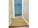 Hallway with light walls and wood-look flooring at 603 Brighton Ct, Norcross, GA 30071