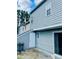 Rear exterior view showing a private patio and storage at 603 Brighton Ct, Norcross, GA 30071