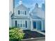 Charming two-story townhome with gray siding and black shutters at 603 Brighton Ct, Norcross, GA 30071