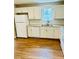 Kitchen with white cabinets, granite counters, and new appliances at 603 Brighton Ct, Norcross, GA 30071