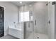 Elegant bathroom with soaking tub and a walk-in shower, featuring modern finishes at 8840 Callaway Dr, Winston, GA 30187