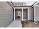 Front entry with gray siding and a dark brown door at 8840 Callaway Dr, Winston, GA 30187