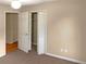 Bedroom with neutral walls, carpeting, and a large closet at 3333 Pinta Way, Douglasville, GA 30135