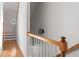 Stairway with wood railing leading to upper level at 581 Cooper Sw St, Atlanta, GA 30312