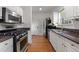Kitchen with granite countertops and stainless steel appliances at 581 Cooper Sw St, Atlanta, GA 30312