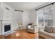 Spacious living room featuring hardwood floors and a cozy fireplace at 581 Cooper Sw St, Atlanta, GA 30312