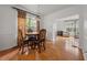 Charming dining room with hardwood floors and a four-person table at 581 Cooper Sw St, Atlanta, GA 30312