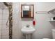 Small bathroom with pedestal sink and shower at 581 Cooper Sw St, Atlanta, GA 30312