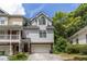 Gray townhome with attached garage and landscaping at 581 Cooper Sw St, Atlanta, GA 30312