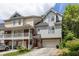 Gray townhome with attached garage and landscaping at 581 Cooper Sw St, Atlanta, GA 30312