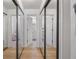 Hallway with mirrored closet doors and bathroom access at 581 Cooper Sw St, Atlanta, GA 30312
