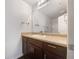 Clean bathroom with dark wood vanity and a large mirror at 2136 Chadwick Sw Rd, Atlanta, GA 30331