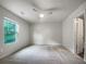 Spacious bedroom with plush carpeting and a large window at 2136 Chadwick Sw Rd, Atlanta, GA 30331