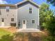 Rear view of gray sided home with small patio at 2136 Chadwick Sw Rd, Atlanta, GA 30331