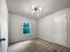 Spacious bedroom with carpeted floor and window at 2136 Chadwick Sw Rd, Atlanta, GA 30331