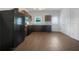 Modern kitchen with dark cabinets and black appliances at 2136 Chadwick Sw Rd, Atlanta, GA 30331