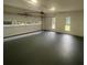 Spacious garage with epoxy flooring and windows at 320 Royal Ridge Way, Fayetteville, GA 30215