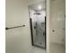 Walk-in shower with marble tile and modern fixtures at 320 Royal Ridge Way, Fayetteville, GA 30215