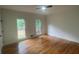 Bright bedroom with hardwood floors and large windows at 320 Royal Ridge Way, Fayetteville, GA 30215
